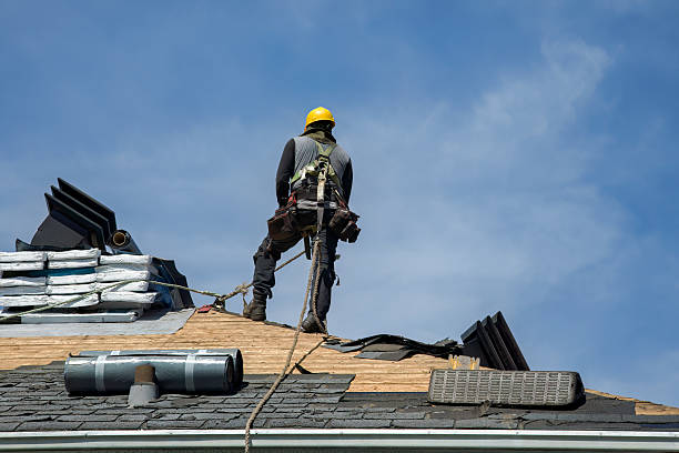Professional Storm Damage Roof Repair technician working in Brooklyn, IA